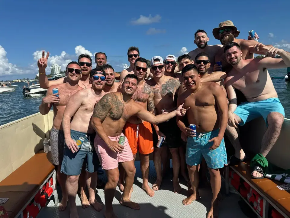 Bachelor party group celebrating aboard Freaky Tiki in Fort Lauderdale